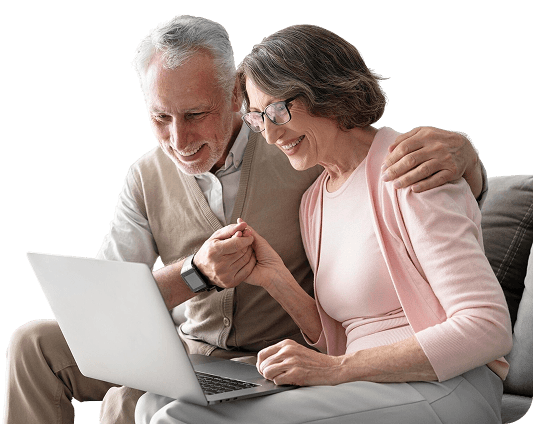 Senior couple planning their federal retirement with laptop